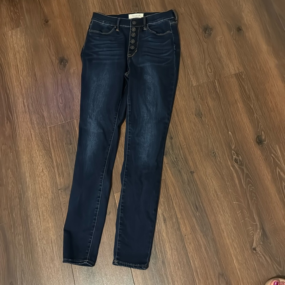 Button detailed dark wash skinny jeans
